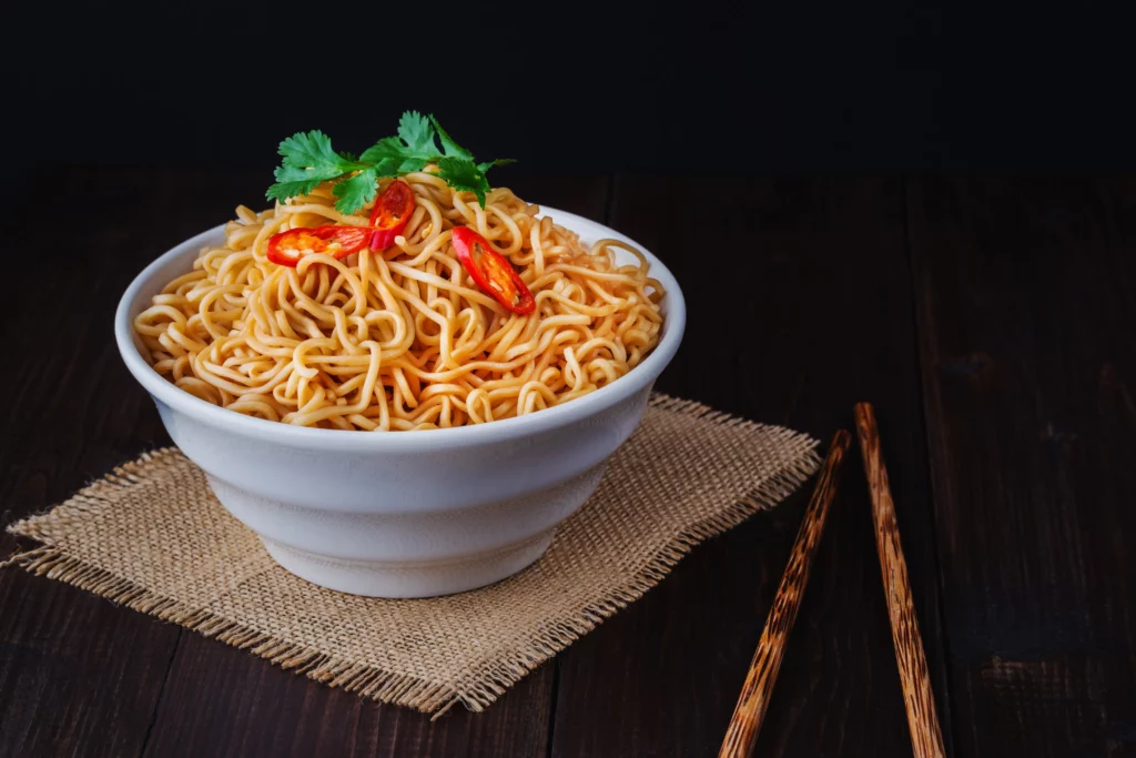 Cooked Instant Noodles Bowl With Chopsticks Close Up Wooden Table 1024x683
