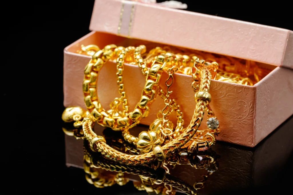 Open Box With Pile Various Golden Jewelry Isolated Black Background