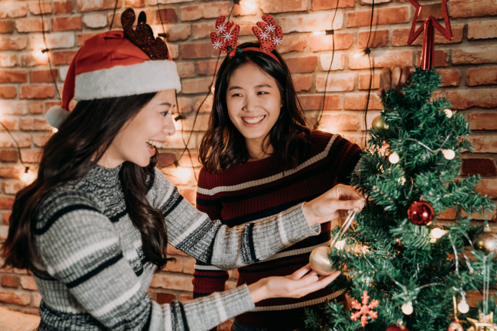 Merry Xmas Happy New Year Are Coming Sisters Decorating Christmas Tree Together Home Young Girls Cheerful Preparing Christmas Eve Concept 1024x683