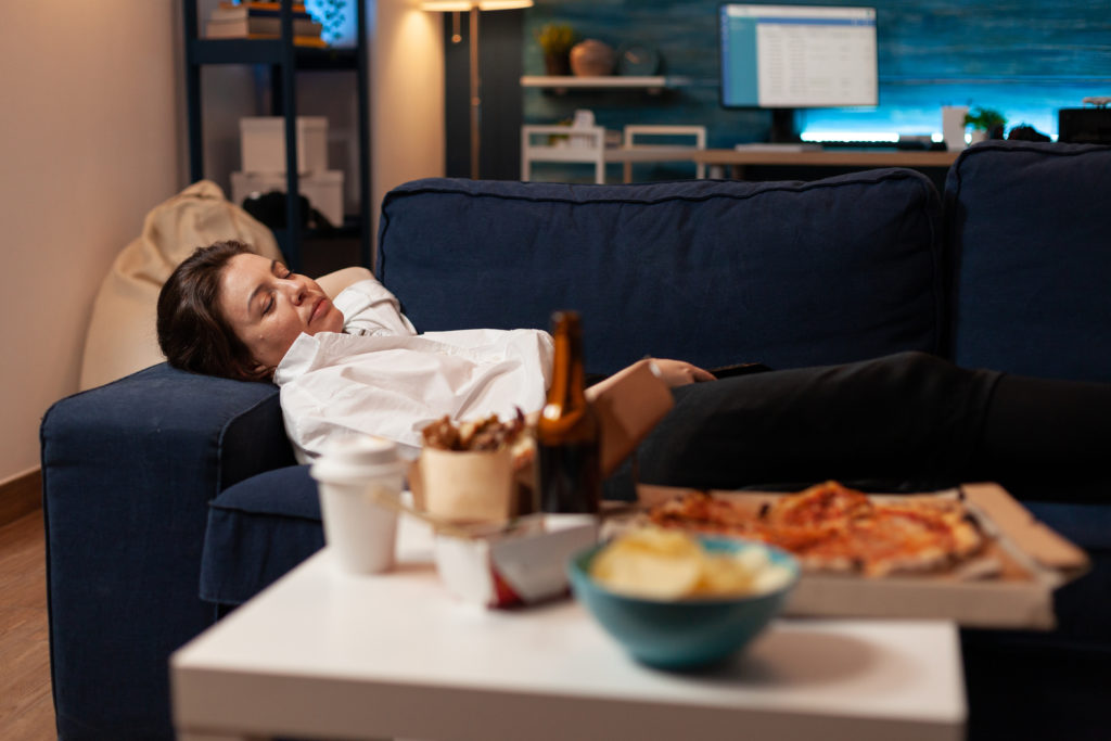Tired Woman Falling Asleep Couch After Large Fast Food Takeaway Dinner Front Television Living Room Person Sleeping Sofa After Drinking Beer Eating Home Delivery Pizza 1024x683