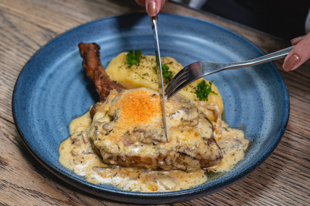 Shaloba Eatery menus -   Pork Chop In Creamy Mushroom Sauce With House Mashed Potato 