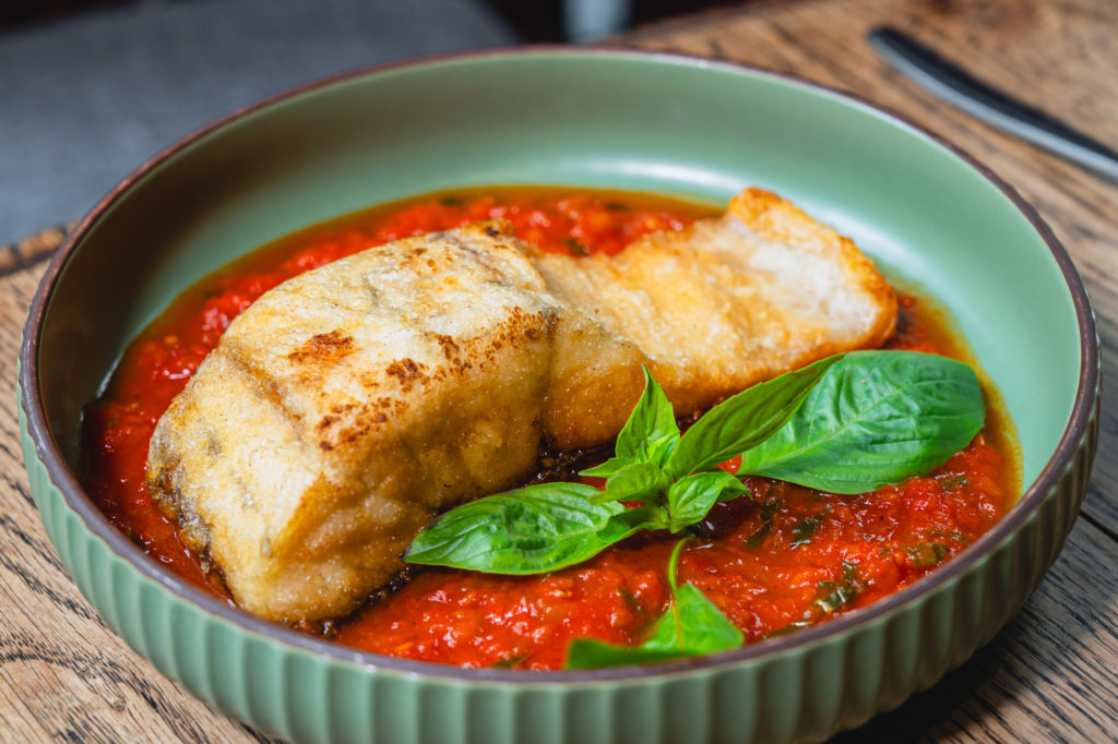 Din Restaurant and Bar Grilled Mediterranean Sea Bass With Marinara Sauce 