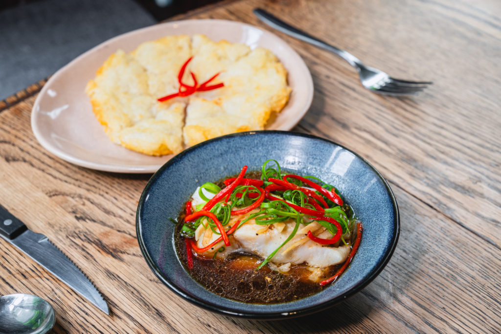 Din Restaurant and Bar Steamed Halibut With Soy Sauce Served With Fried Noodles